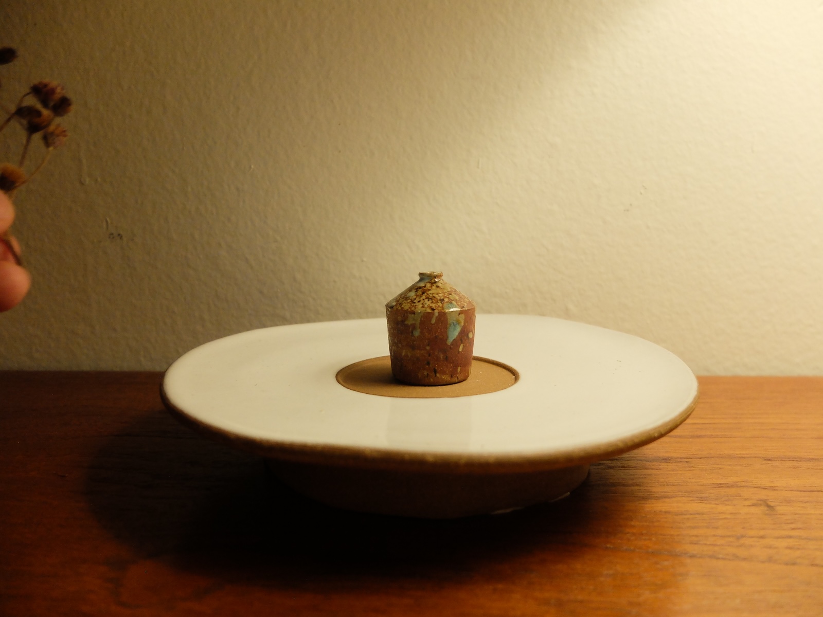 photo of a travel vase on a windowsill