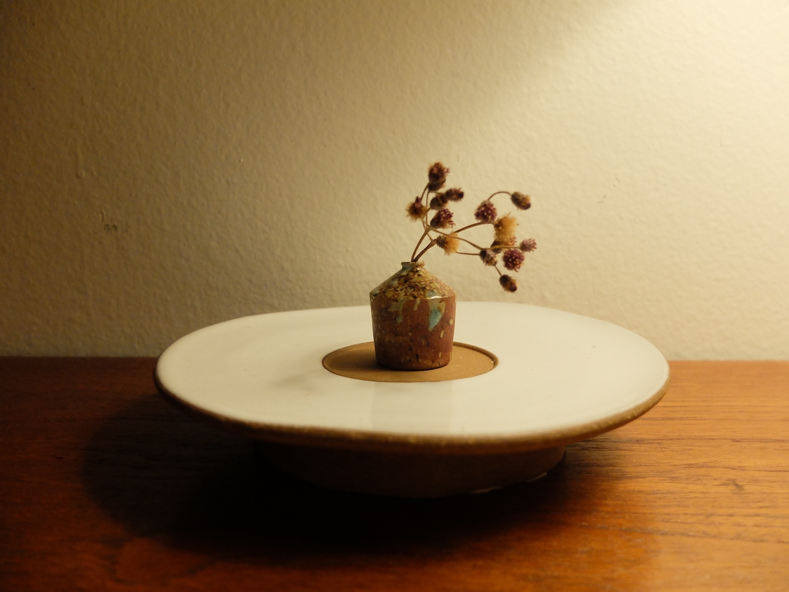 photo of a travel vase on a windowsill